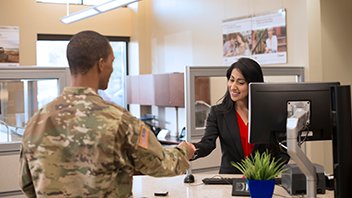 Uniformed armed-forces client with a banker